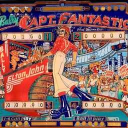Colorful vintage Captain Fantastic pinball backglass featuring a flamboyantly dressed figure in a red star-patterned shirt, white bell-bottoms, oversized blue platform boots, knit cap, and round glasses, posing beside a bright red Elton John pinball machine. A cheering crowd, score displays, signs, stars, and carnival-like details fill the busy red, blue, turquoise, and orange artwork.