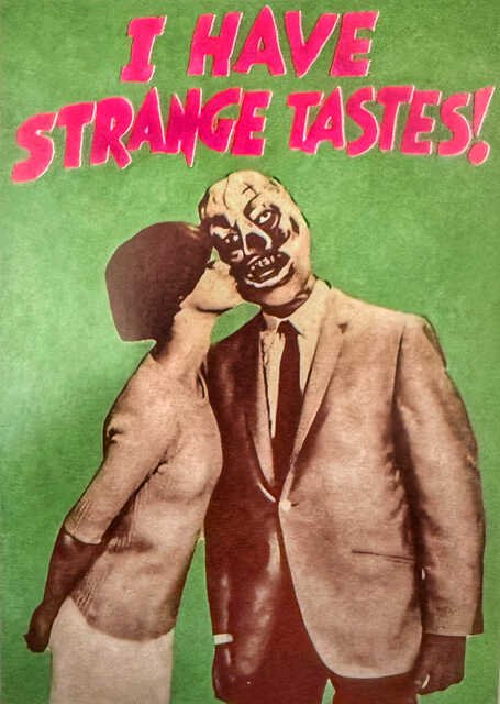 Vintage-style collage on a mottled green background showing a suited couple embracing, with one figure wearing a grotesque, distorted mask-like face. Large jagged pink lettering across the top reads, “I HAVE STRANGE TASTES!”