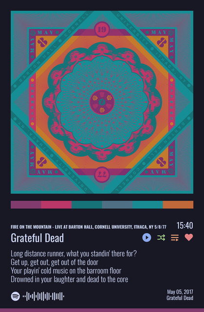 Music player screen showing the Grateful Dead performing “Fire on the Mountain” live at Barton Hall, Cornell University, Ithaca, New York, on May 8, 1977. The album artwork features a colorful geometric mandala in teal, magenta, and orange with stylized skull motifs and the concert details around the border. The screen displays the current lyric: “Long distance runner, what you standin’ there for? Get up, get out, get out of the door...” along with playback controls and a progress time of 15:40.